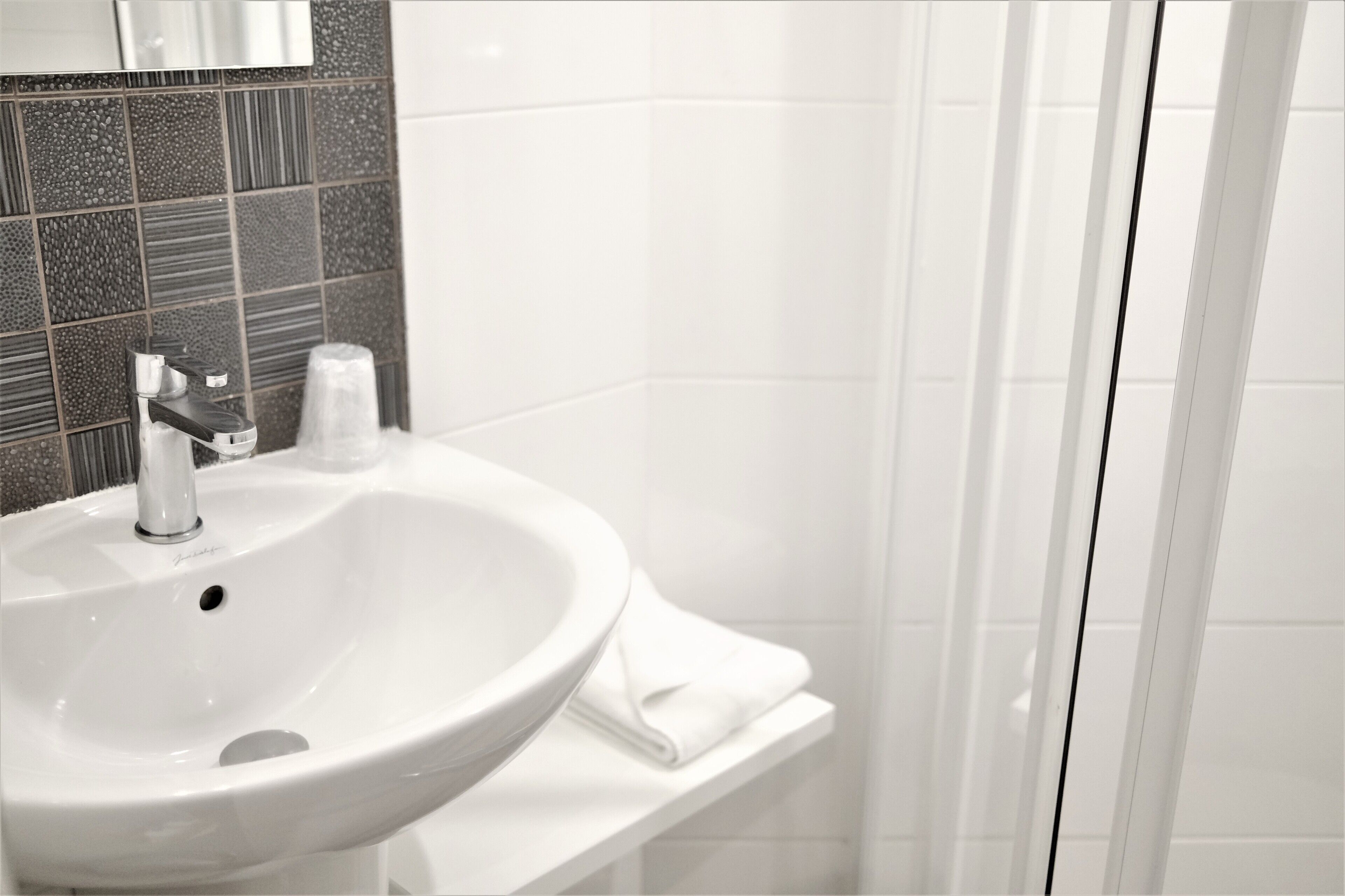 shower, free toiletries, hair dryer, towels