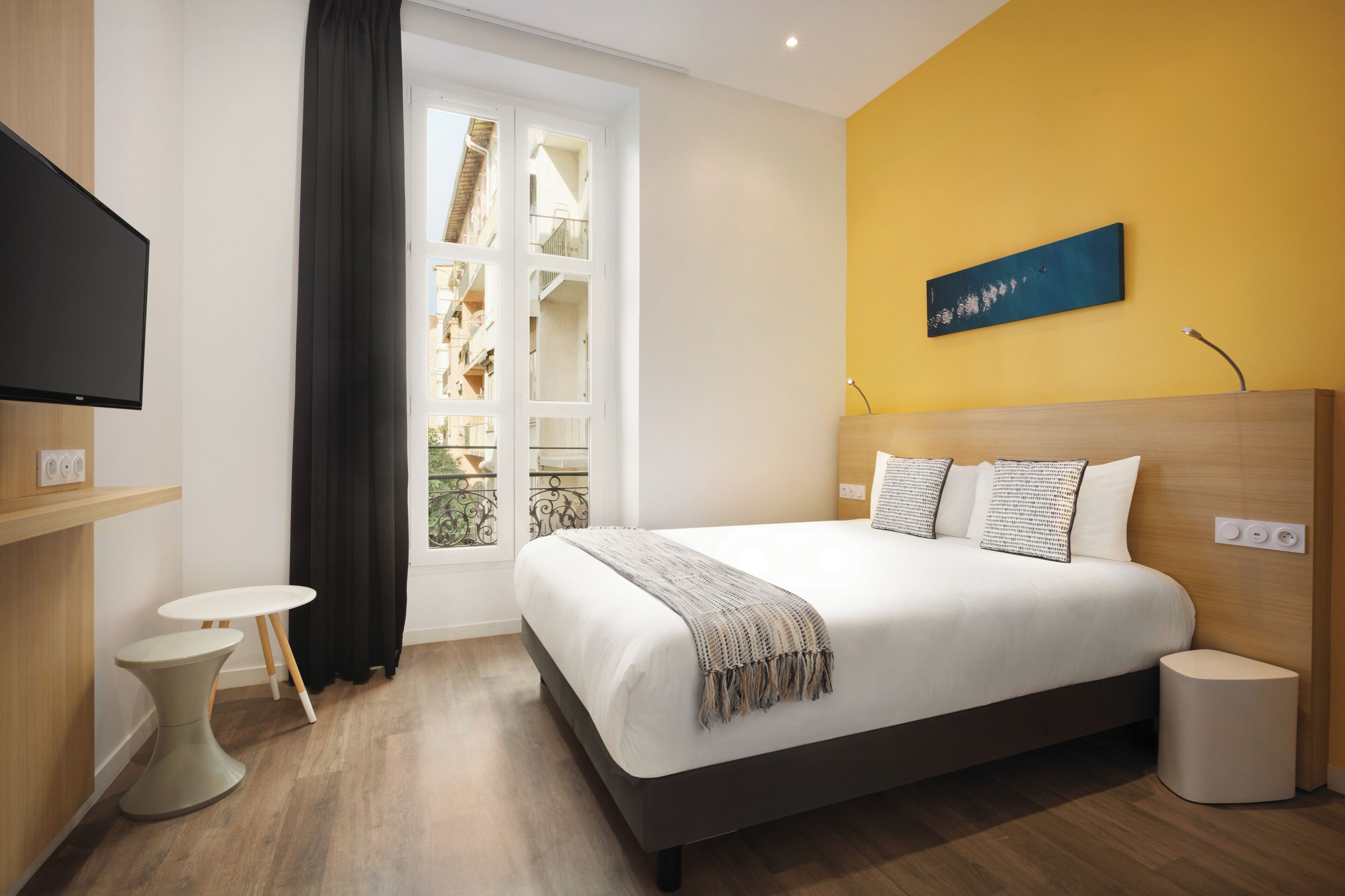 Hypo-allergenic bedding, desk, laptop workspace, blackout curtains