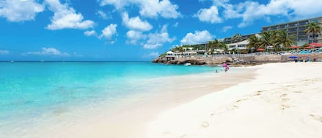 On the beach, sun loungers, beach umbrellas, beach towels