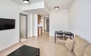 Comfort Apartment | Living area | TV