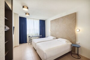 Estúdio conforto | Cofres nos quartos, berços grátis, Wi-Fi de cortesia, roupa de cama