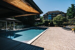 Seasonal outdoor pool, open 8:30 AM to 8:00 PM, pool umbrellas