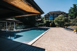 Seasonal outdoor pool, open 8:30 AM to 8:00 PM, pool umbrellas