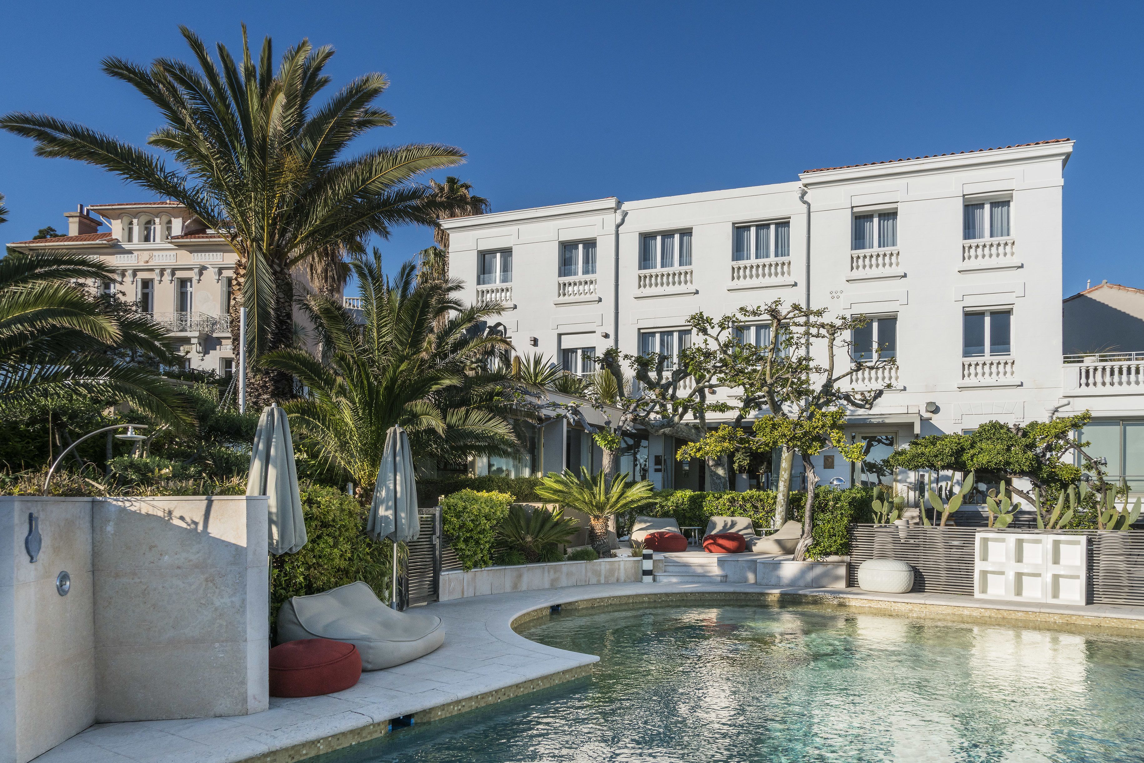 seasonal outdoor pool, pool umbrellas, pool loungers