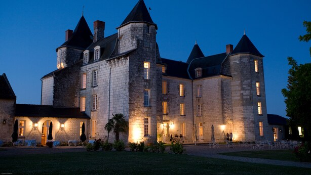 A large stone building with multiple towers and arched windows, likely a historic hotel or castle. - Château de Marçay (Marcay)