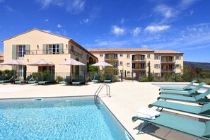 Seasonal outdoor pool, pool umbrellas, pool loungers