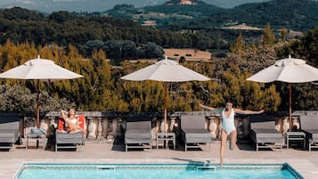 Indoor pool, pool umbrellas, pool loungers