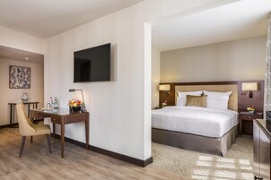 Premium bedding, desk, laptop workspace, blackout curtains