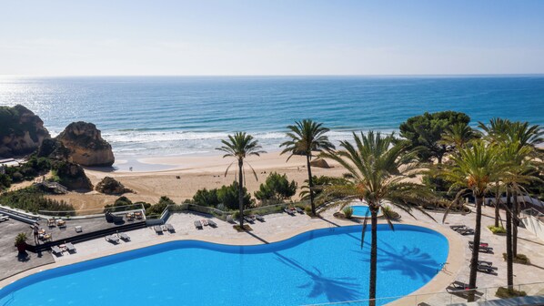 On the beach, surfing