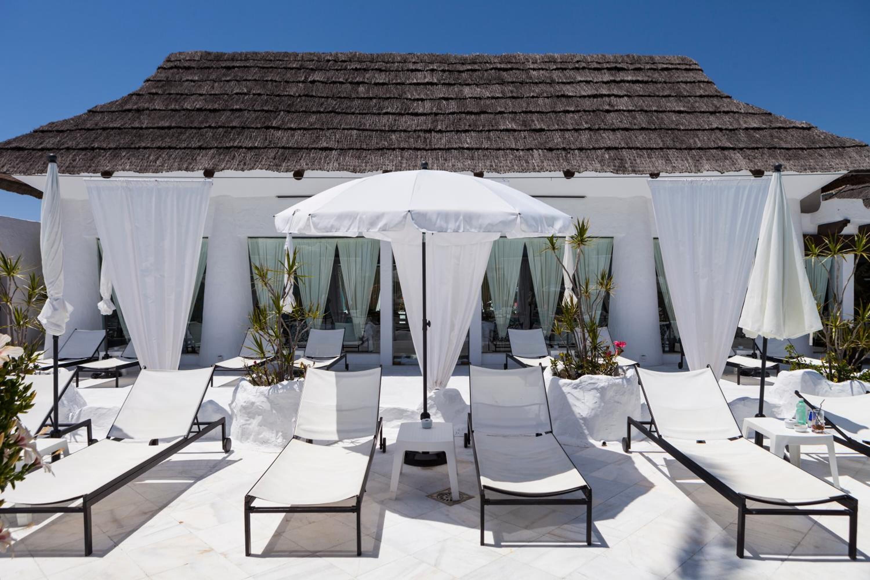 Outdoor pool, open 10:00 AM to 7:00 PM, pool umbrellas, sun loungers