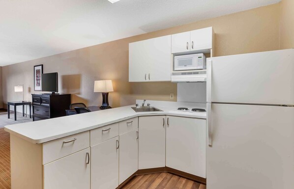 Fridge, microwave, stovetop, coffee/tea maker