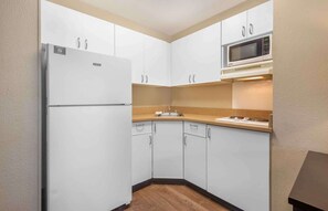 Deluxe Studio, 1 King Bed with Sofa bed, Non Smoking | Private kitchen | Full-size fridge, microwave, stovetop, coffee/tea maker