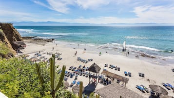 On the beach, sun loungers, beach umbrellas, beach towels