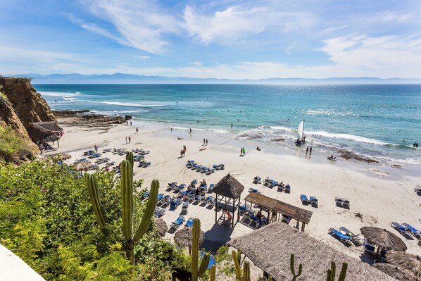 On the beach, sun-loungers, beach umbrellas, beach towels