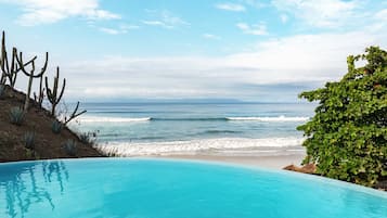 On the beach, sun-loungers, beach umbrellas, beach towels