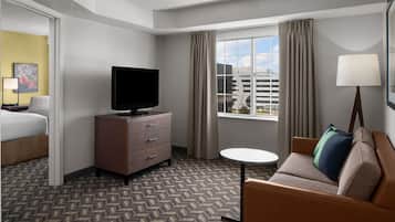 Premium bedding, desk, laptop workspace, blackout curtains