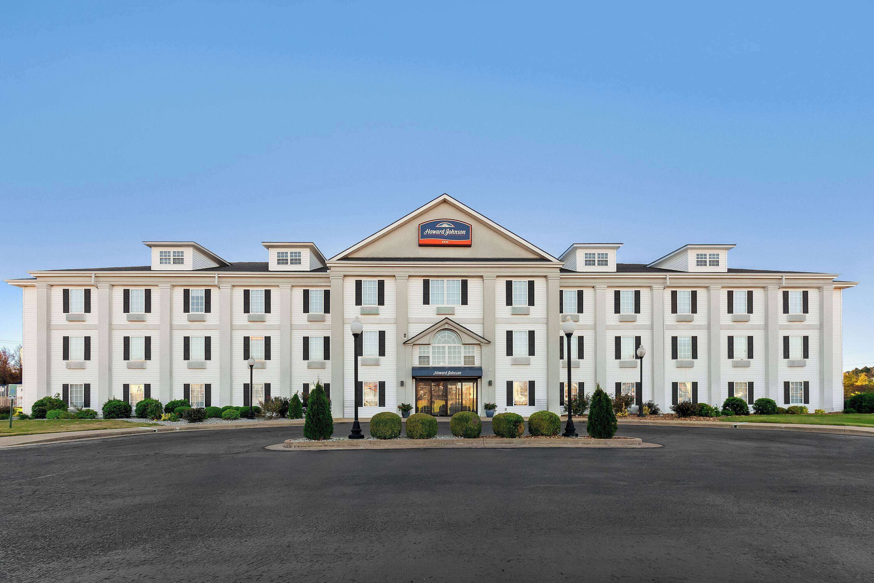 A large, multi-story hotel with a prominent sign reading "Howard Johnson."