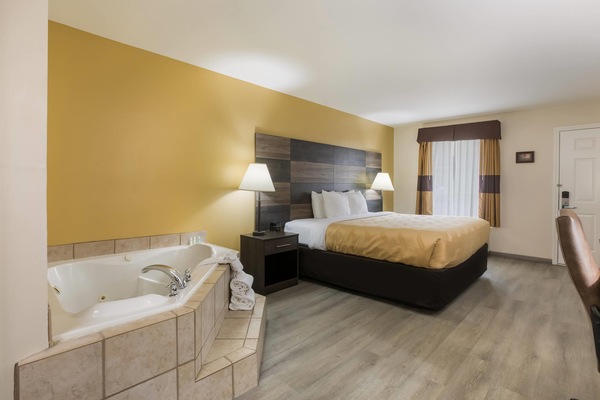 Suite, 1 King Bed, Non Smoking | Desk, iron/ironing board, WiFi (free), bed sheets