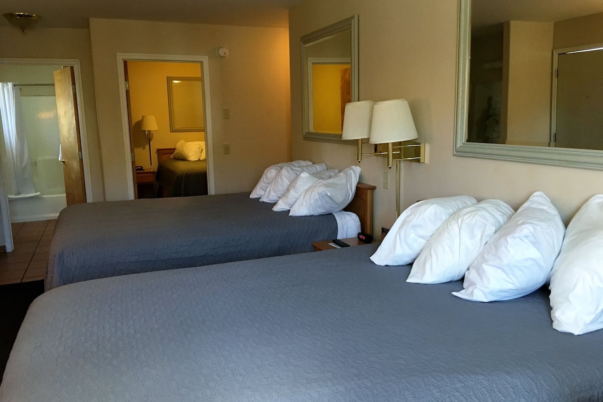 Family Room- 3 Queen Beds | 1 bedroom, individually decorated, individually furnished, desk