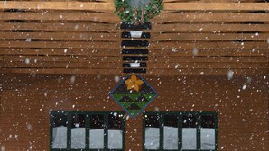 A wooden building with a snow-covered entrance and a wreath above the doors.