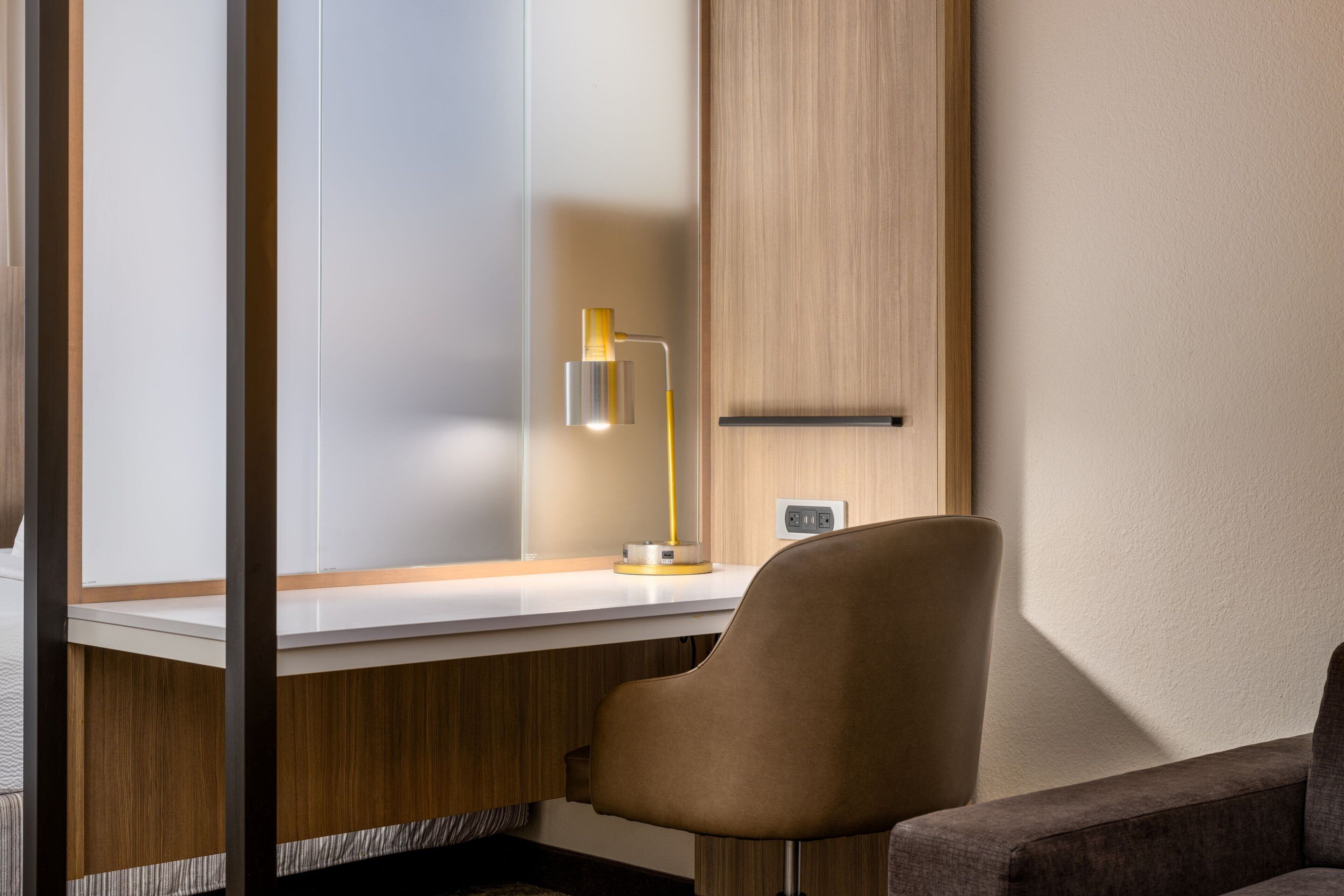 pillow-top beds, desk, laptop workspace, blackout curtains