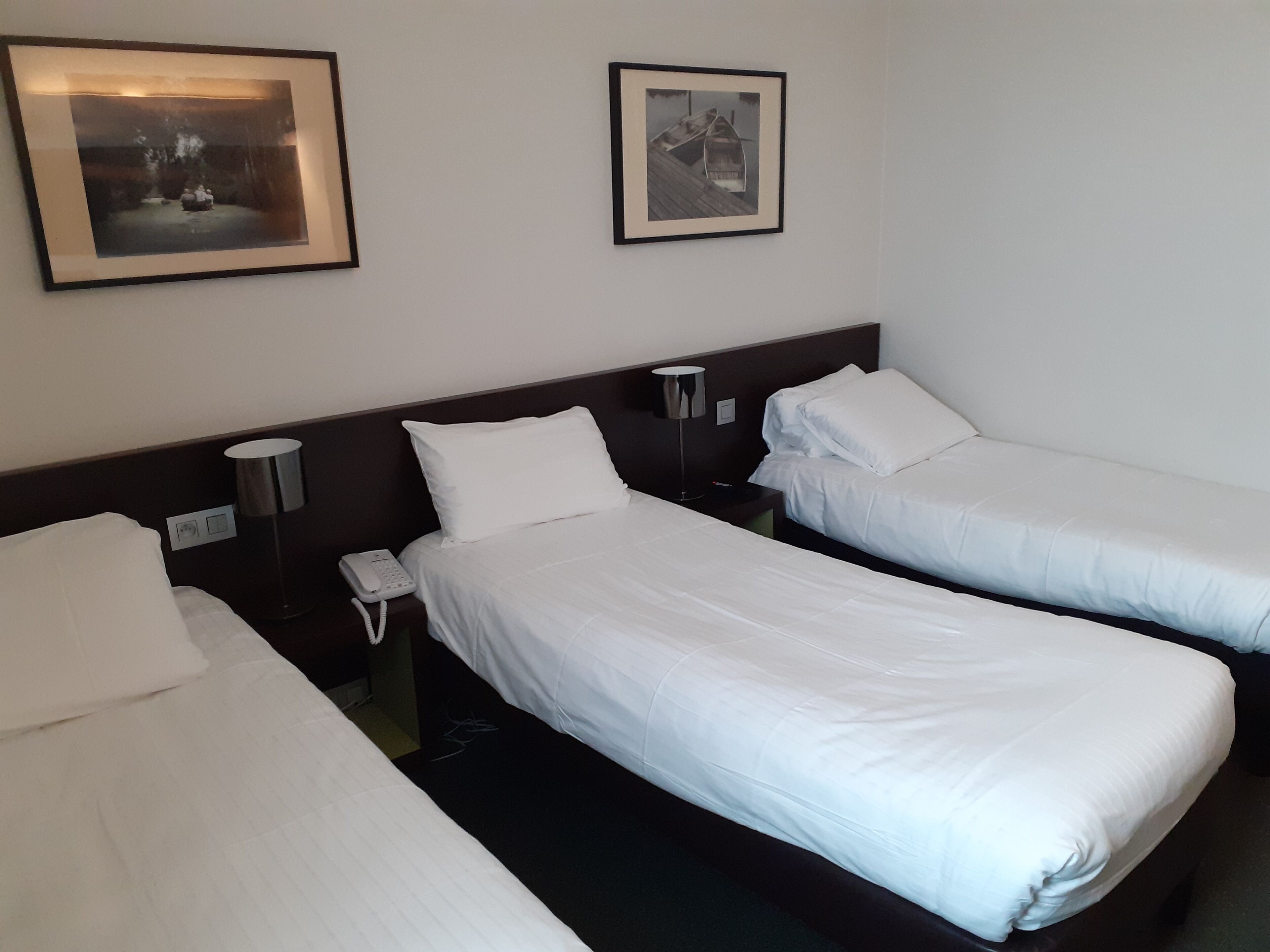 standard room, 3 single beds | desk, soundproofing, free cots/infant beds, rollaway beds