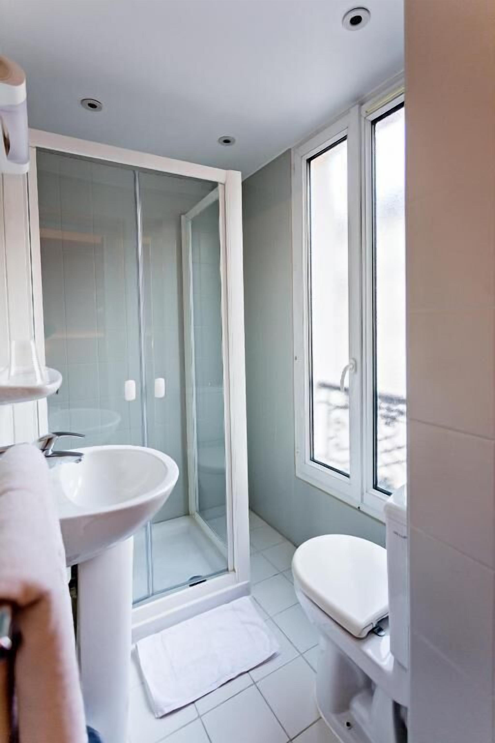 Shower, rainfall showerhead, hair dryer, towels