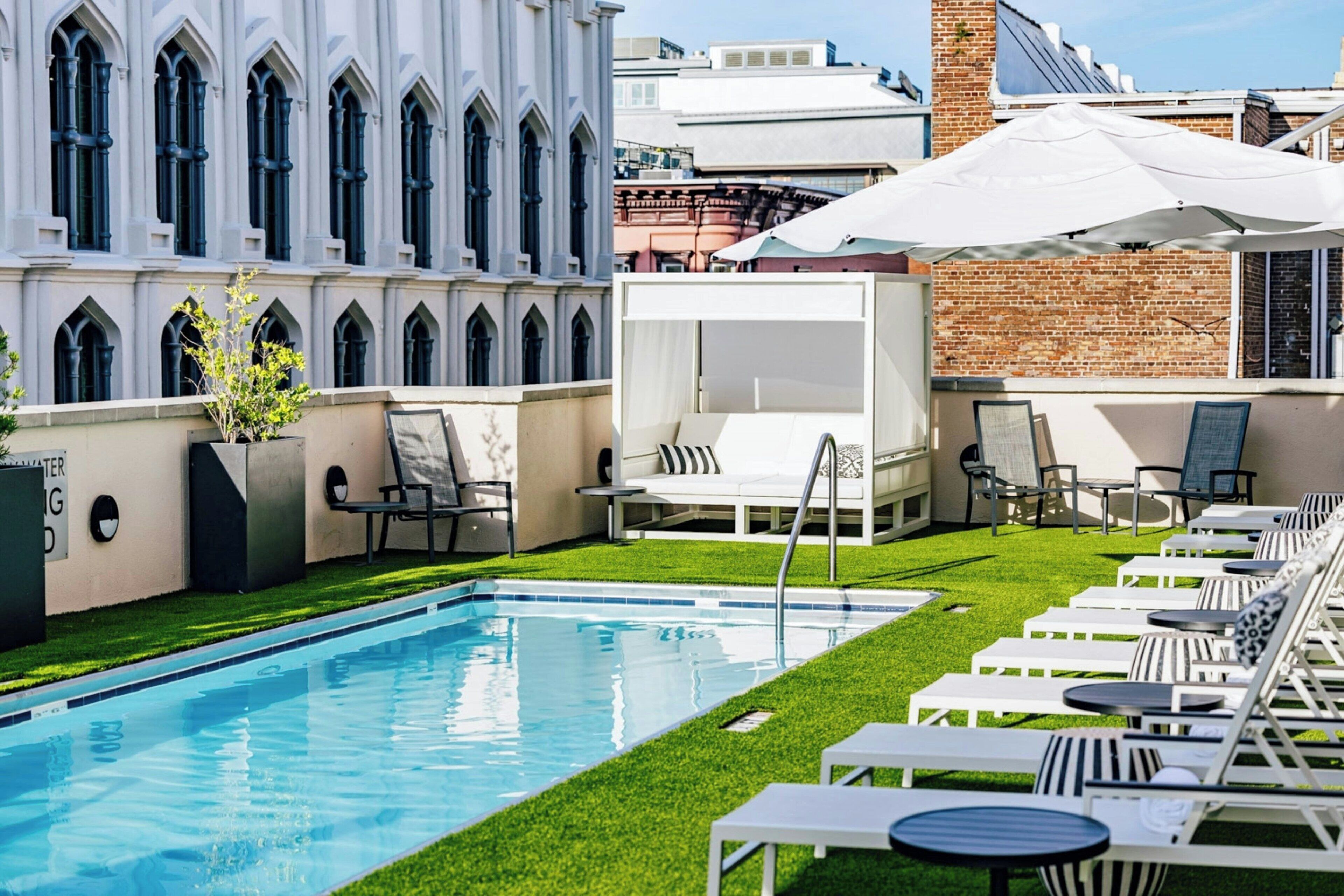 Outdoor pool, open 7:30 AM to 6:30 PM, pool loungers