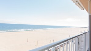 A beach view from a balcony with a clear sky. - Comfort Inn Ocean City Boardwalk (Ocean City)