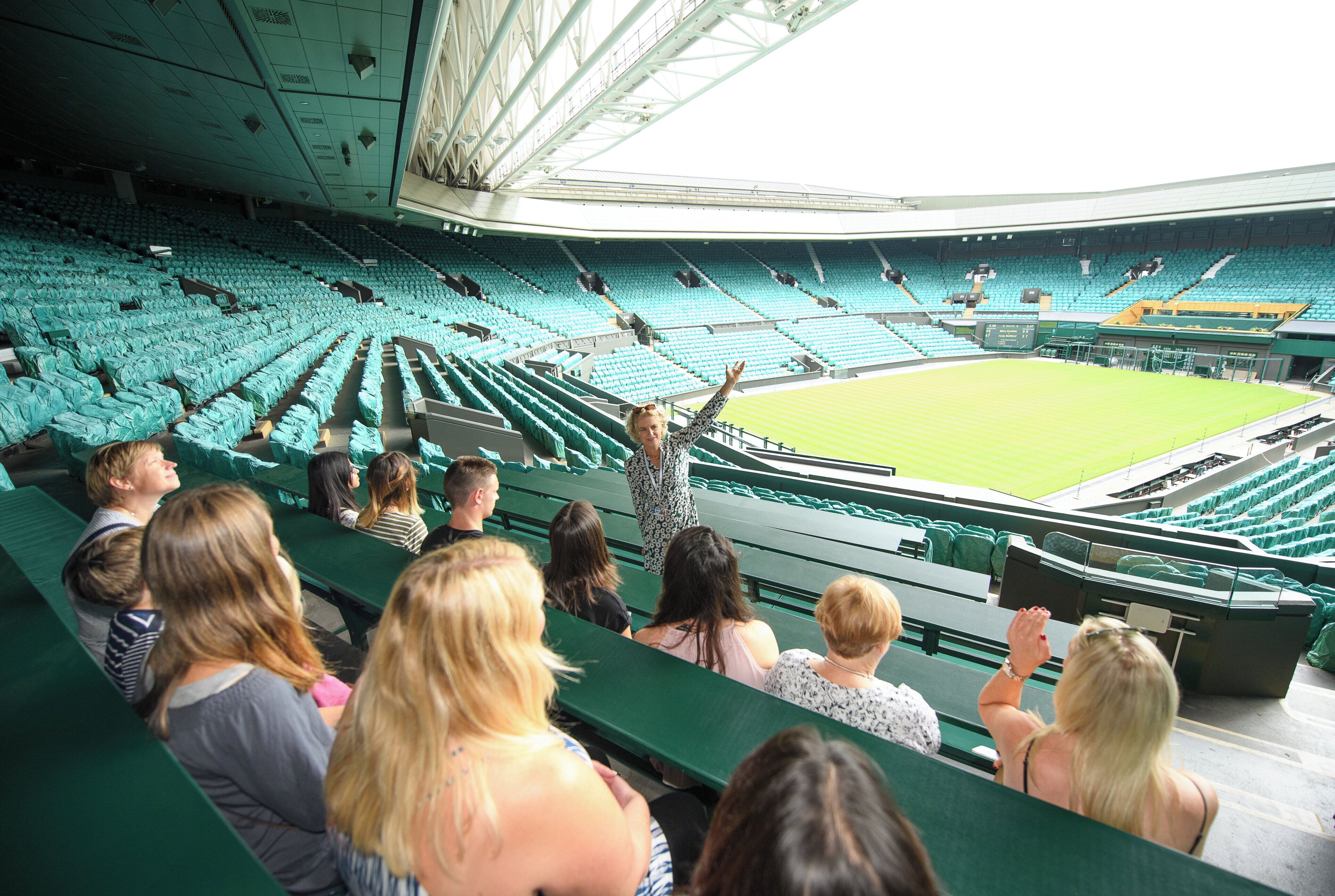 A stadium with tiered seating and a central field.