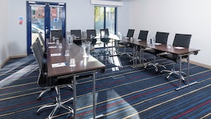 A conference room with a long table, multiple chairs, and a carpeted floor. - Holiday Inn Express London Wandsworth by IHG (London)