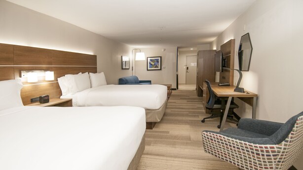 A hotel room with two beds, a desk, a chair, and a TV. - Holiday Inn Express & Suites Plano West - Frisco by IHG (Plano)