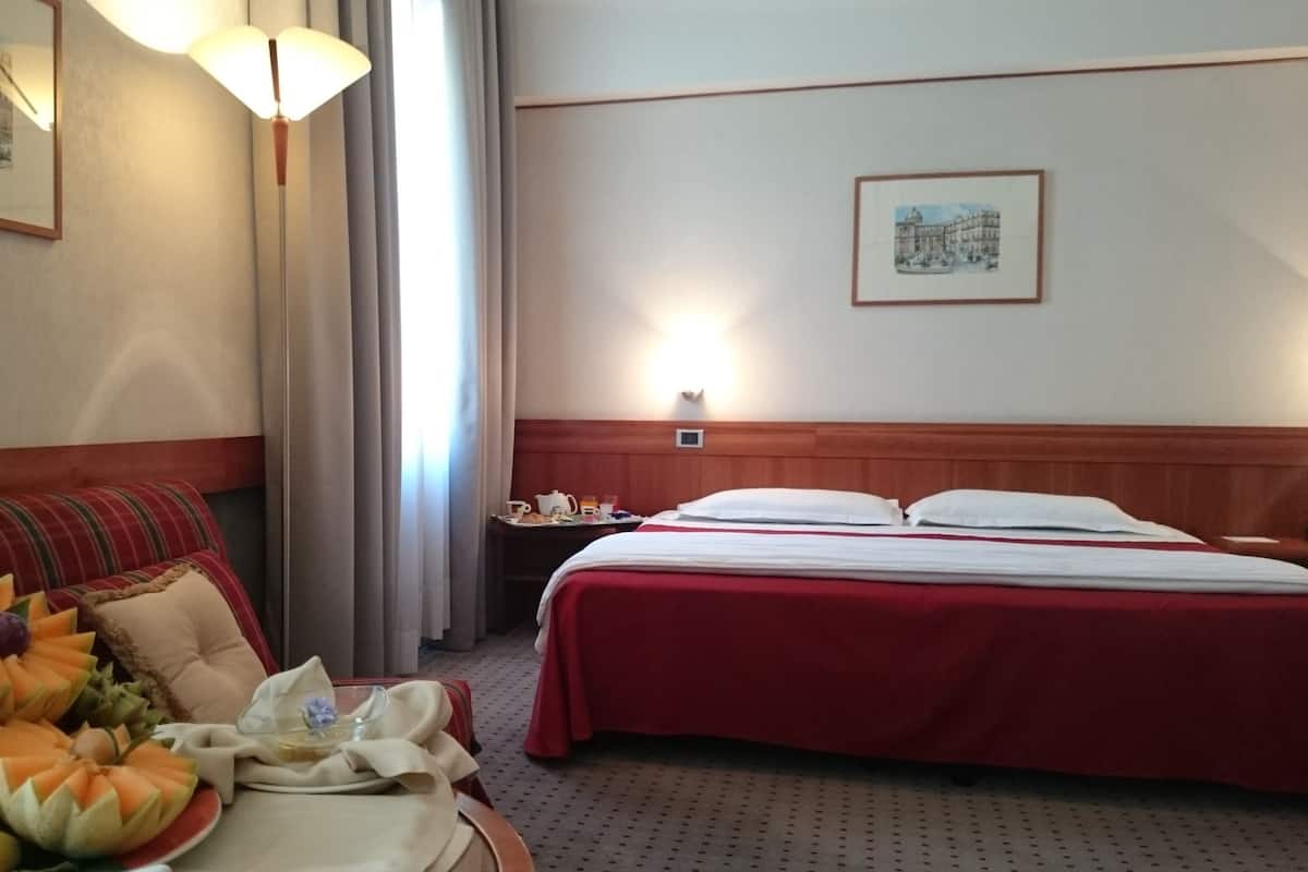 Family Room | Minibar, in-room safe, desk, iron/ironing board (on request)