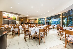 Breakfast, lunch, dinner served; international cuisine, garden views 