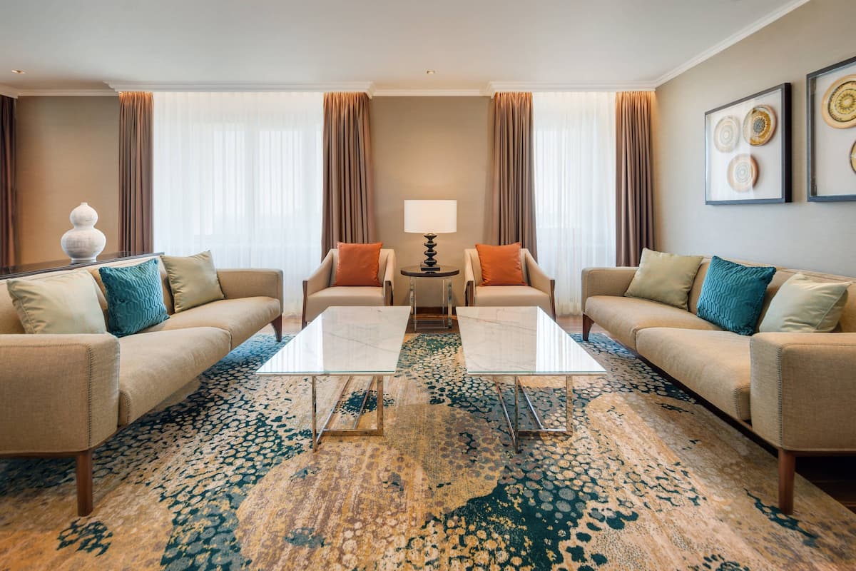 Presidential Suite, 1 Bedroom | Living area | 49-inch plasma TV with satellite channels, TV
