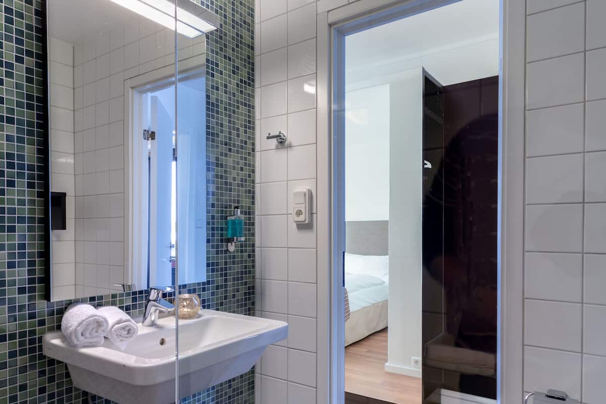 shower, eco-friendly toiletries, towels