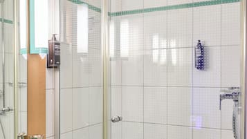 Shower, eco-friendly toiletries, hair dryer, towels