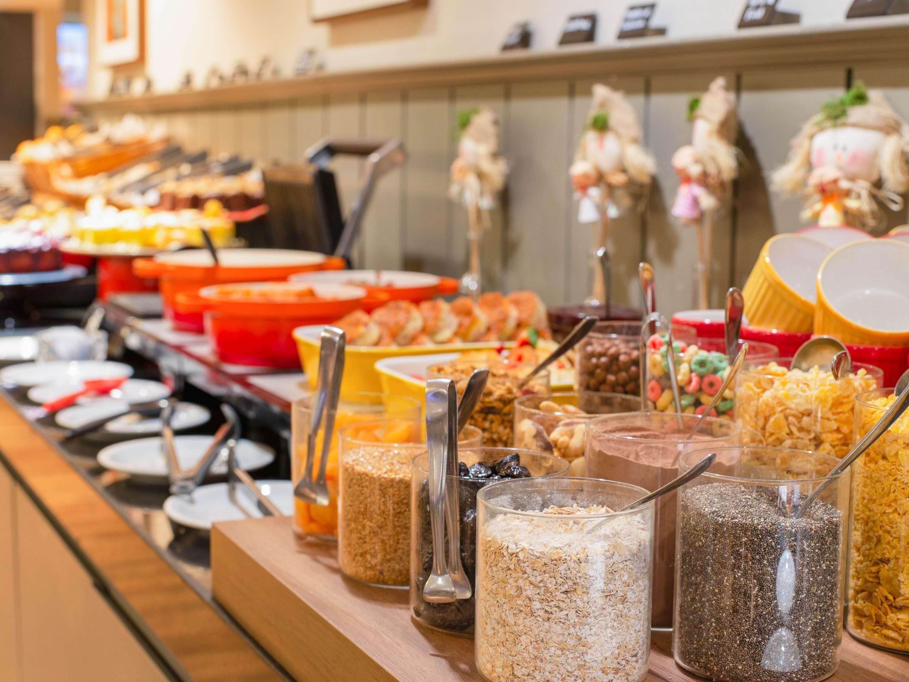 A buffet with various food items and containers.