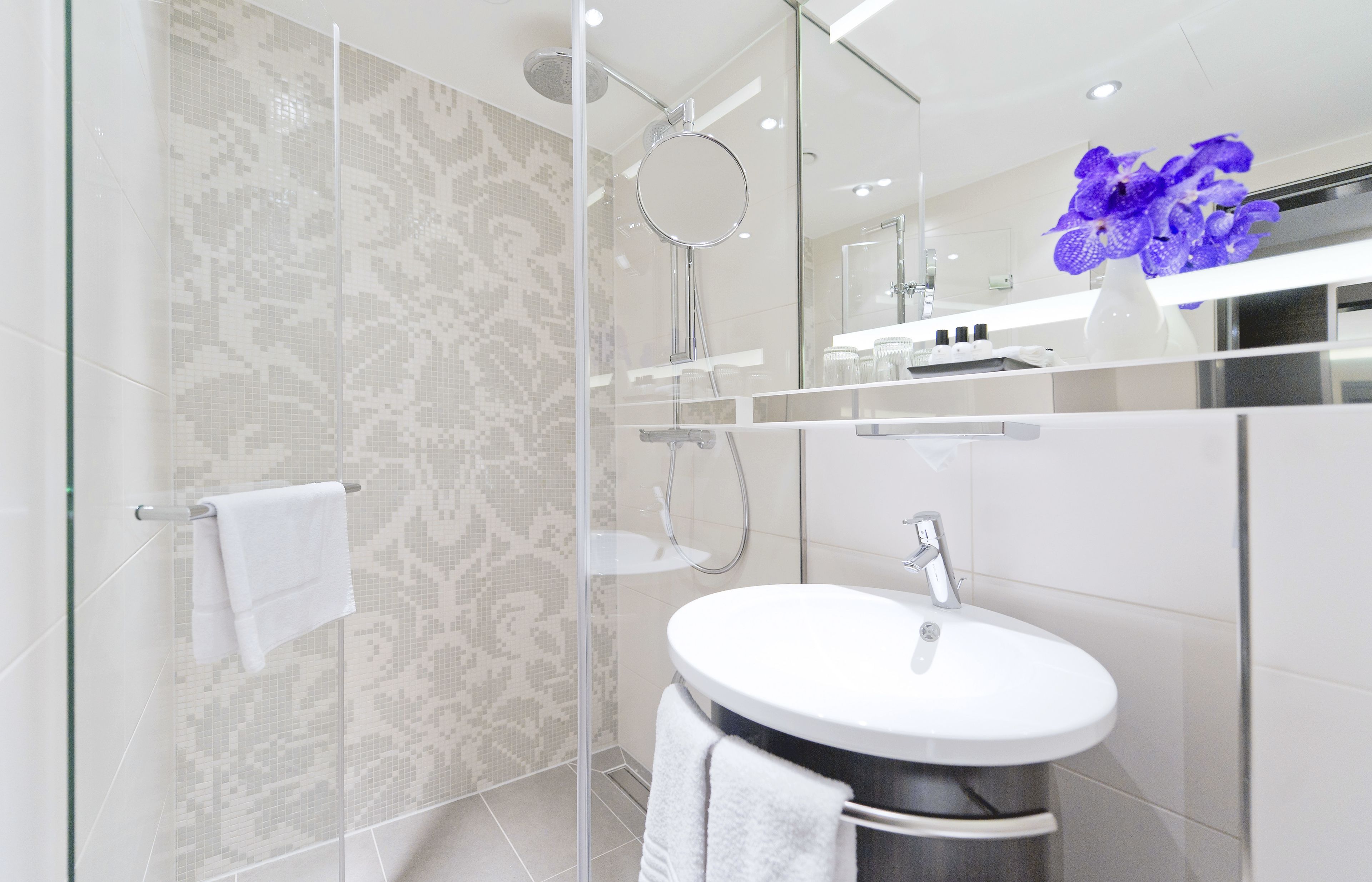 rainfall showerhead, eco-friendly toiletries, hair dryer, towels