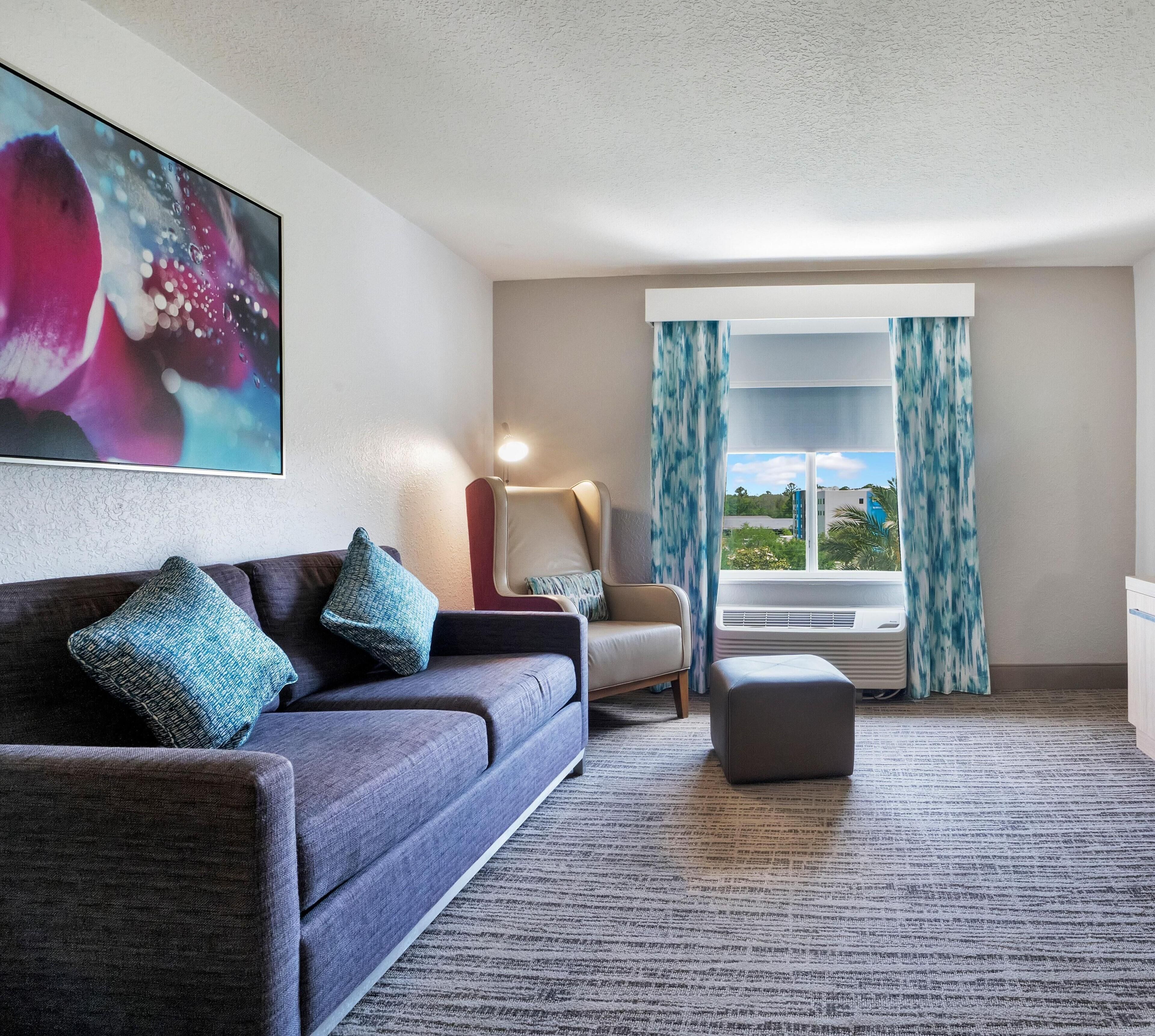 One Bedroom Suite, One King Bed | Living area | 32-inch LCD TV with cable channels, TV, video-game console