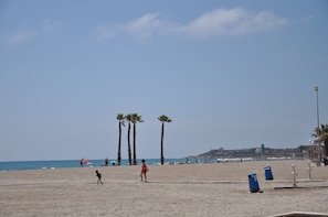 Beach nearby, white sand, beach towels