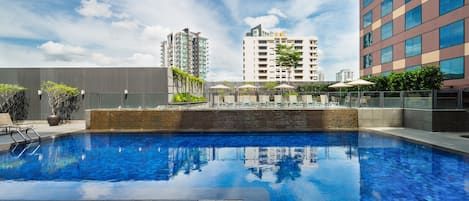 Outdoor pool, pool umbrellas, sun loungers