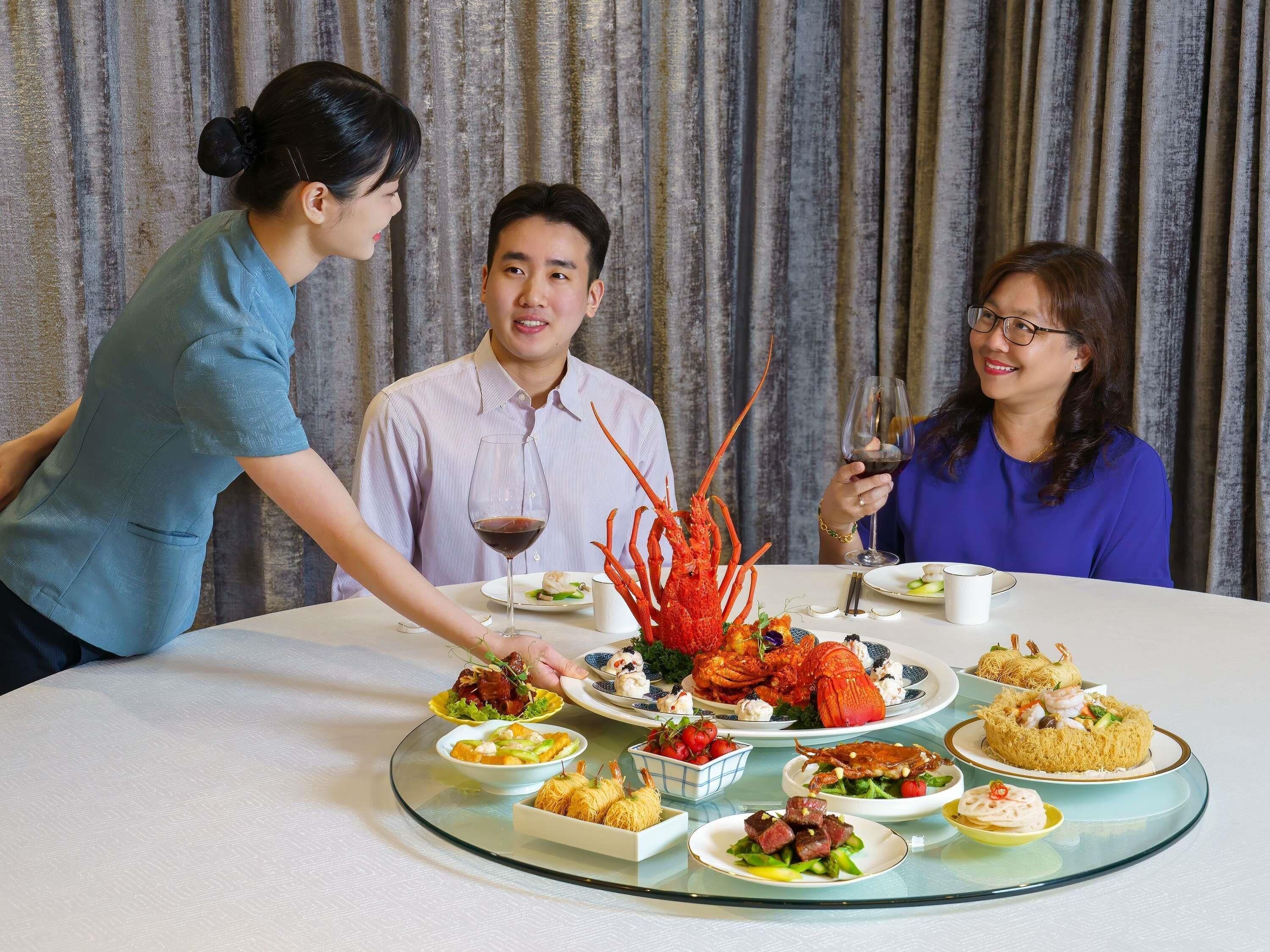 A dining table with various dishes and a lobster centerpiece.