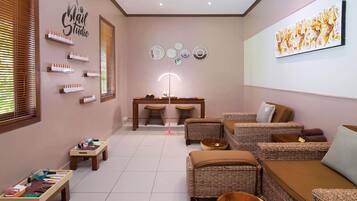 Relax in a stylish space with a comfortable seating area, wicker furniture, and a wooden table.