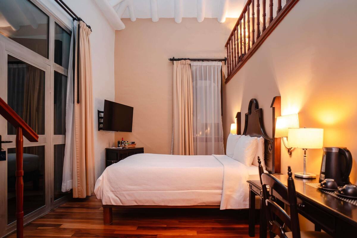 Family Duplex, 1 Queen Bed (Colonial) | Minibar, in-room safe, desk, iron/ironing board (on request)