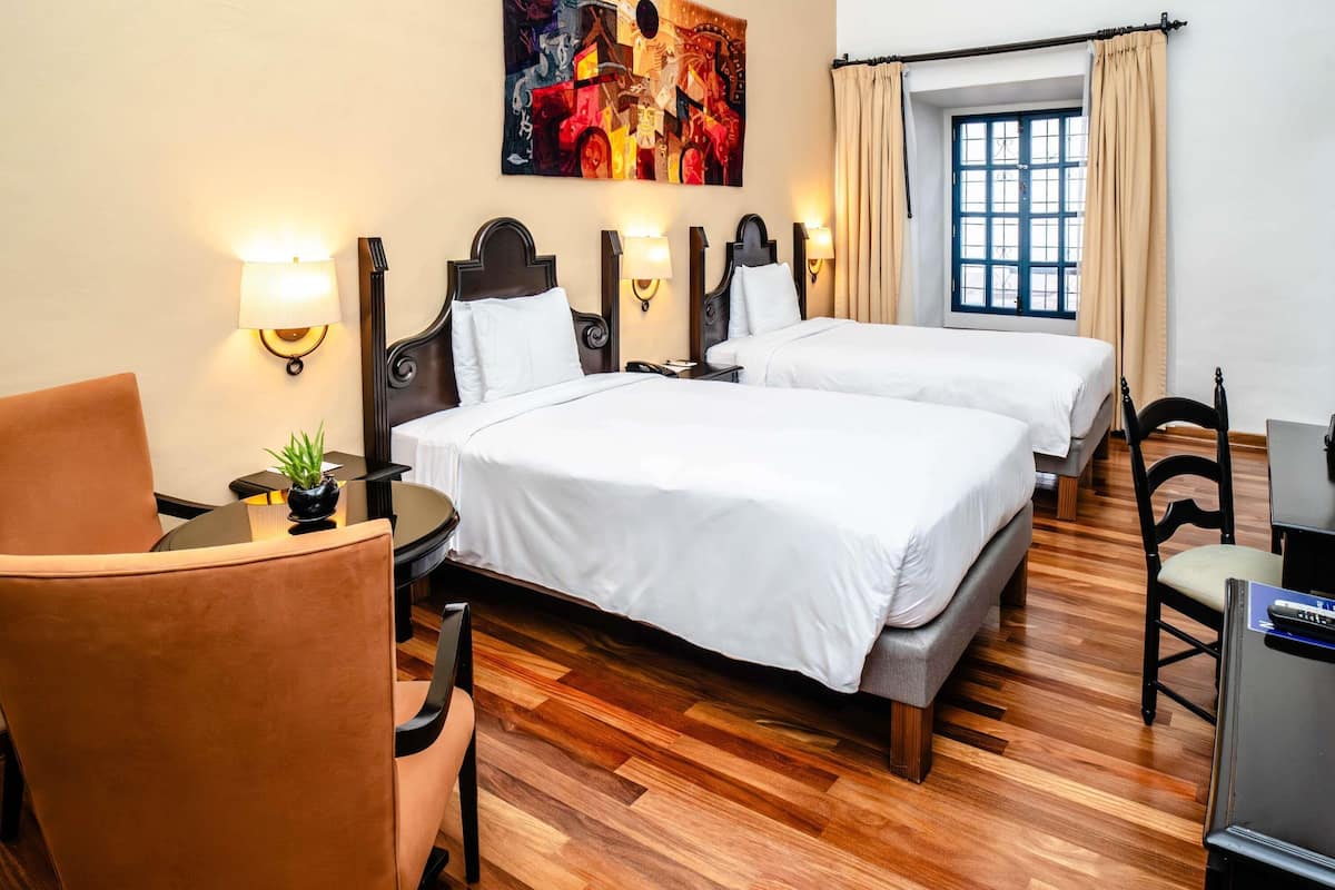 room, 2 single beds (colonial) | minibar, in-room safe, desk, iron/ironing board