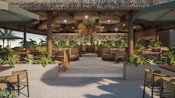 Sulla spiaggia, sabbia bianca, cabine (a pagamento), lettini da mare