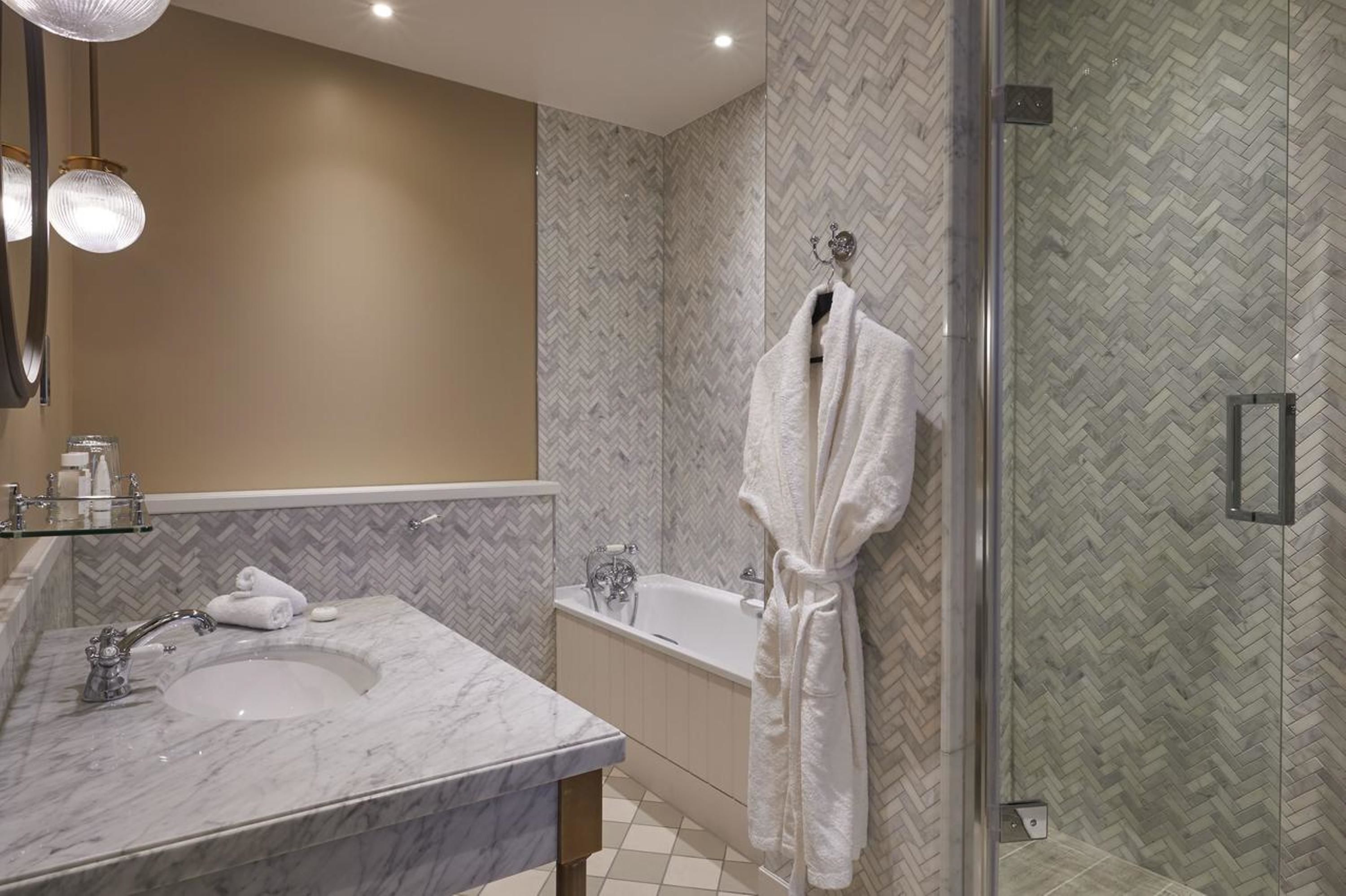 Shower, designer toiletries, hair dryer, bathrobes