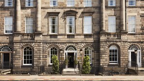 A historic building with a symmetrical facade, large windows, and a central entrance with steps. - Kimpton Charlotte Square by IHG (Edinburgh)