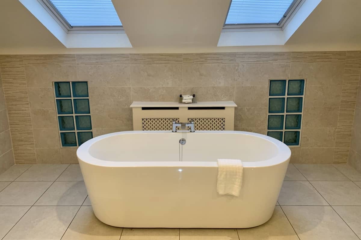 junior studio suite | bathroom | free toiletries, hair dryer, soap, shampoo